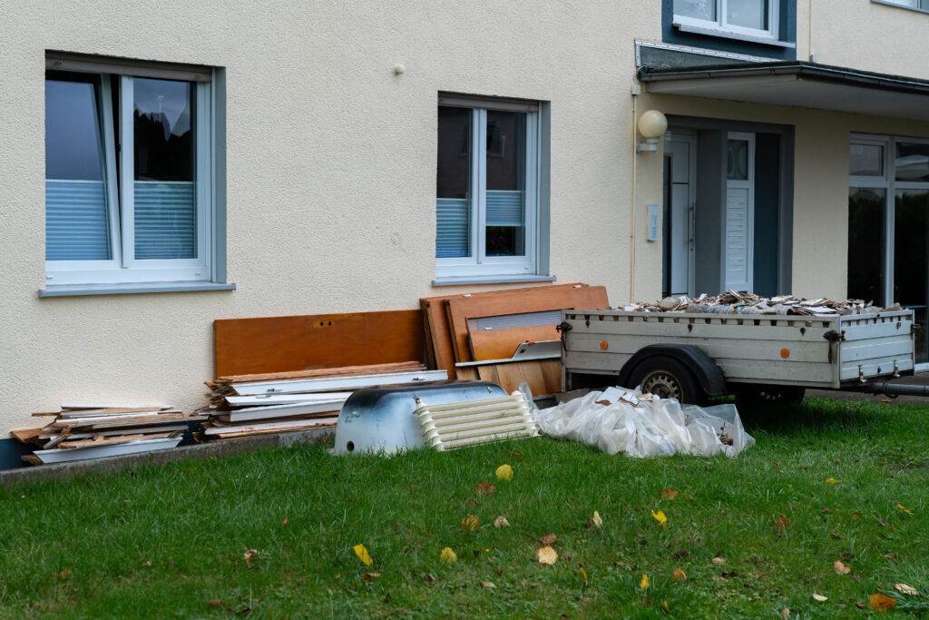 Discarded materials and debris outside a residential building