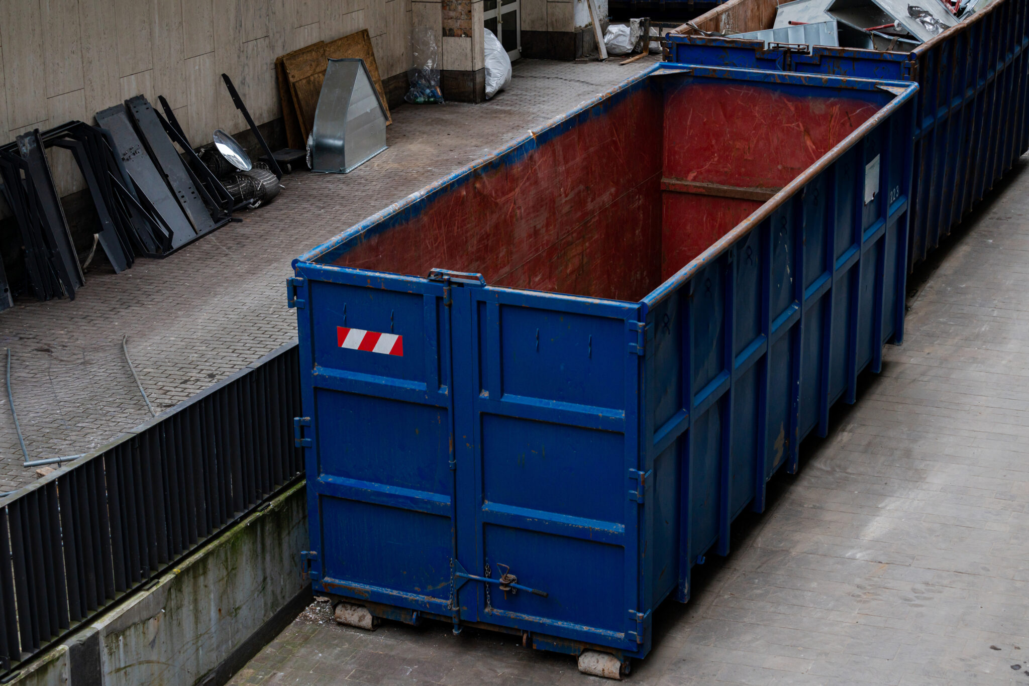 A large blue dumpster
